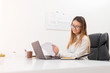 © Bojan Topalovic - Beautiful manager girl working in her home office.