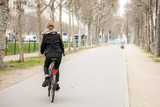Fototapeta  - Woman riding a bike