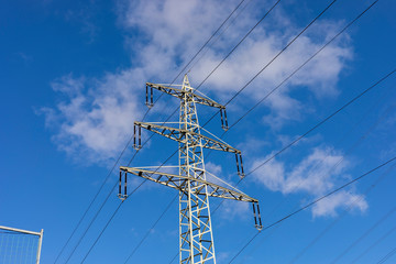 high voltage post.High-voltage tower sky background in Germany