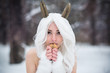 Cosplay girl in fantasy style in snow in winter