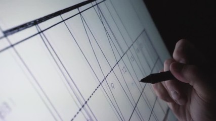 Wall Mural - close-up of hands designer architect using creative pen display tablet in the work at night