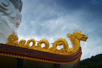 Vietnam travel. Ho Quoc Pagoda at Phu Quoc Island. Golden dragon exterior details