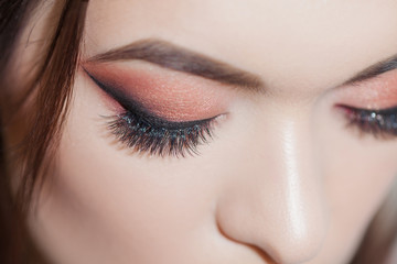 Amazing Bright eye makeup with a wide arrow. Brown and red tones, colored eyeshadow.