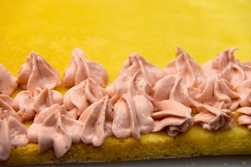  Preparation of cake with strawberry cream ornament, traditional pastry in Latin America.