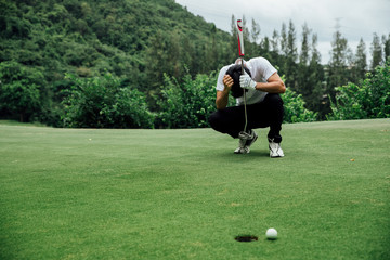 Golfer stress and sit on the golf course. failure idea concept.