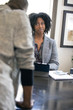 © Innovated Captures - Black female client is upset at tax preparer or CPA accountant in an office.  The image can also depict a manager angry at a secretary.