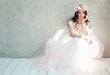 Beautiful bride woman in tulle roses wedding dress, lifestyle portrait