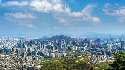 Fototapete - Time lapse of Cityscape in Seoul with Seoul tower and blue sky, South Korea.
