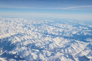 Wall Mural - Aerial view of snow covered mountains - snowy mountain peaks - high mountains - Alps