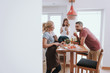 © Yakobchuk Olena - Happy family spending time together in kitchen while preparing for dinner