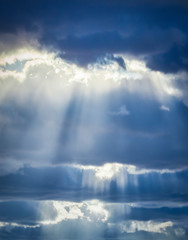 Fototapete - Dramatic sky. The sun's rays among the clouds.