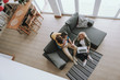 © Yakobchuk Olena - Loving parents spending time with their cute daughter at home