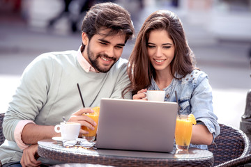 Canvas Print - Happy couple spending time at coffee shop