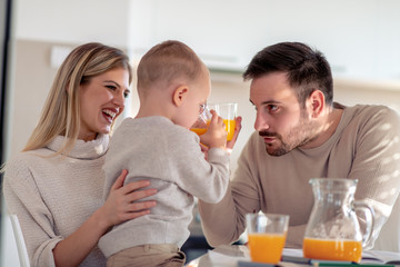 Sticker - Family with child having fresh fruit juice at home