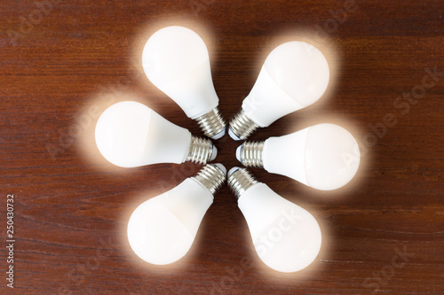 Power Saving Concept Asia Man Changing Compact Fluorescent Cfl