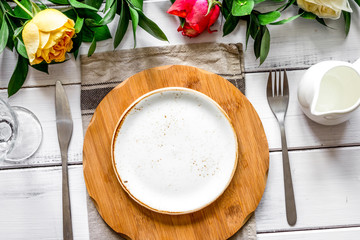 ceramic tableware top view on wooden background mock up