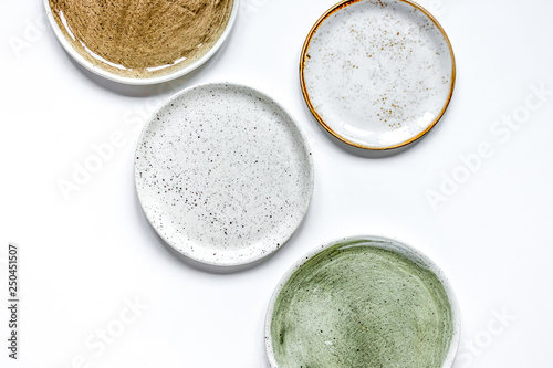 Fotografía ceramic tableware top view on white background mock up