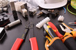 © Davizro Photography - Industrial electricity tools on black table close up elevated