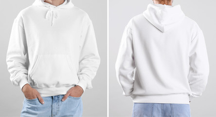 Man in blank hoodie sweater on light background, closeup. Mock up for desing