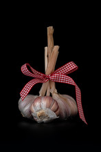3 Garlic Tubers Tied With Red White Checkered Ribbon