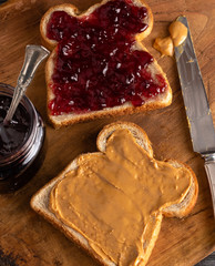 Peanut Butter and Jelly Sandwich on a Wooden Kitchen Counter