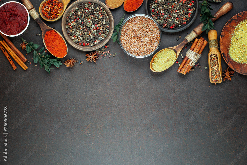 Spices and seasonings for cooking in the composition on the table - obrazy, fototapety, plakaty 