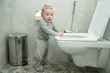 © voffka23 - A curious little boy looks in the toilet