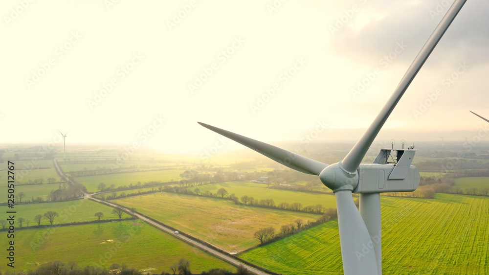 Aerial photo of wind turbines at sunset in Sainte Pazanne, France - obrazy, fototapety, plakaty 