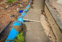Flood Water Flow Causing Landslides And Municipal Water Pipes Made Of PVC Broken. Large PVC Pipe Of Water Supply Was Broken From Flood And Erosion.