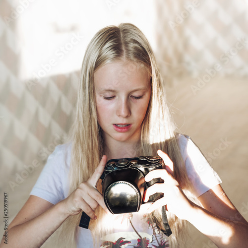 Very Beautiful Blogger Girl With Blonde Hair And Blue Eyes Hold