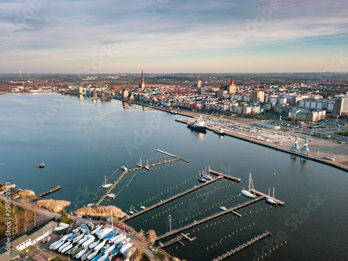 Cuadros en Lienzo port of rostock - aerial view over the river warnow - background city of rostock