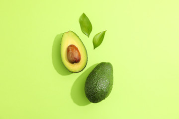 Flat lay composition with ripe avocados on white background, space for text. Top view