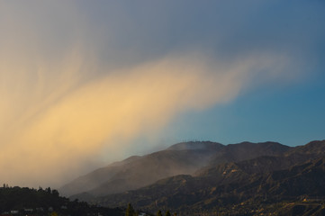 Wall Mural - Rain clouds over the San Gabriel Mountains in California