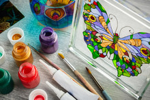 Artisan Painting With Stained Glass Paints On A Glass.