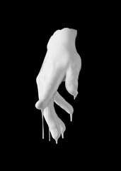 concept image of white paint dripping on female hand