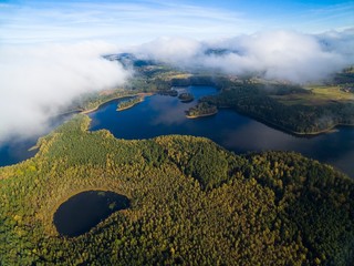 Canvas Print - Low level clouds over beautiful landscape of Mazury region during autumn season - Kacze Lake and Krzywa Kuta Lake, Poland