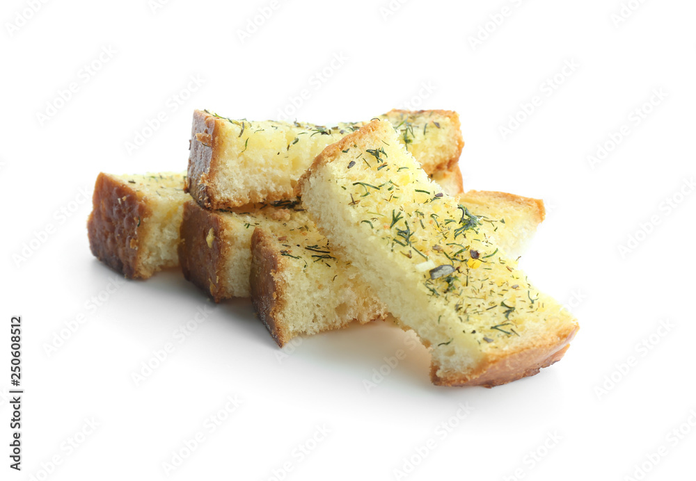 Tasty cut garlic bread on white background