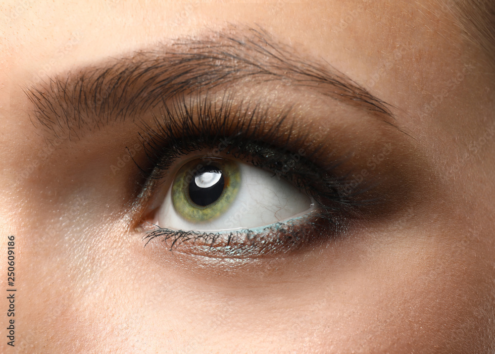 Beautiful young woman with bright makeup, closeup