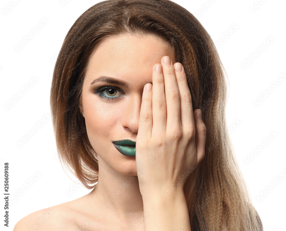 Beautiful young woman with bright makeup on white background