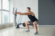 © Pixel-Shot - Sporty young man training in gym