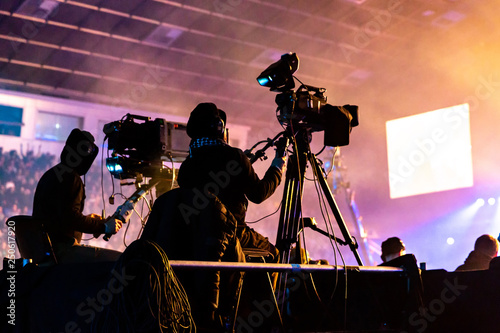 A group of cameramen working during the concert. Принти на полотні