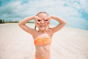 Cute little girl at beach during summer vacation