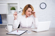 © Di Studio - stressed or tired mature female doctor sitting in modern office