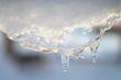 Snow melting icicle spring background.
