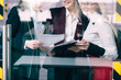 © golubovy - Big contract discussion. Successful negotiations. Smiling team members behind office glass door.