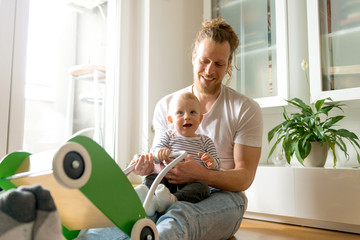 Wall Mural - Father and son playing	