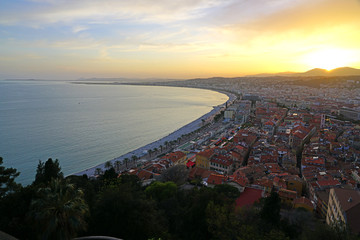 Wall Mural - Landscape view at sunset of the Promenade des Anglais along the Mediterranean Sea in Nice, French Riviera