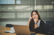 © reewungjunerr - Asian businesswoman stress from hard work,Thai worker woman working in the office,Woman thinking concept