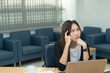 © reewungjunerr - Asian businesswoman stress from hard work,Thai worker woman working in the office,Woman thinking concept