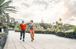© Alessandro Biascioli - Happy fitness couple running outdoor - Fit joggers friends training outside - People, fitness lifestyle, healthy and jogging concept